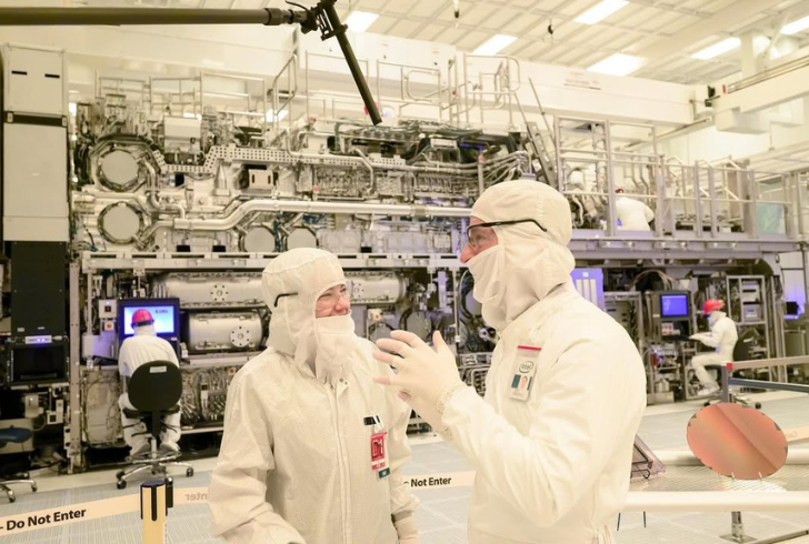 Intel factory workers and chip machines